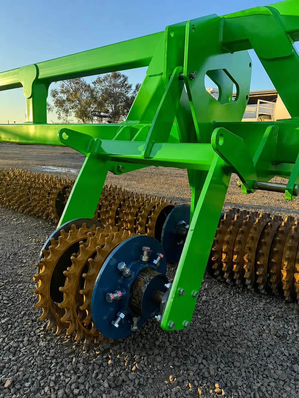 Close-up of the ribbed steel rollers and hub on an Ultimate Ag cultipacker