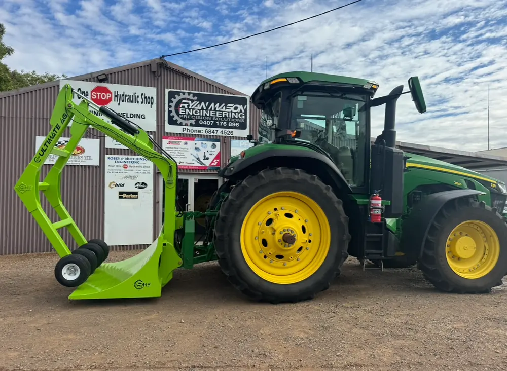 Ultimate Ag bale grab attachment fitted to a John Deere tractor outside the Ryan Mason Engineering workshop in Warren NSW